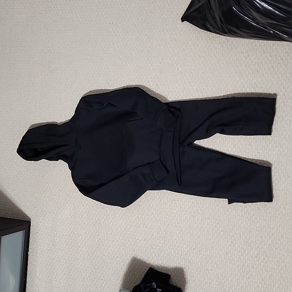 Black tracksuit.